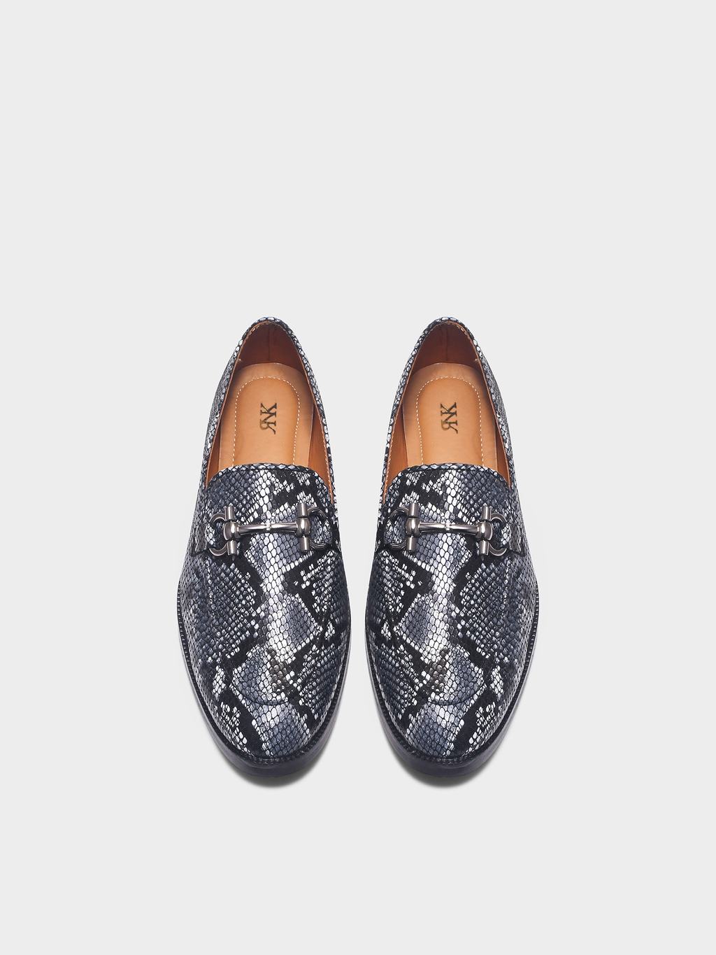 Preview of Pair of snake print horsebit loafers on a light gray background