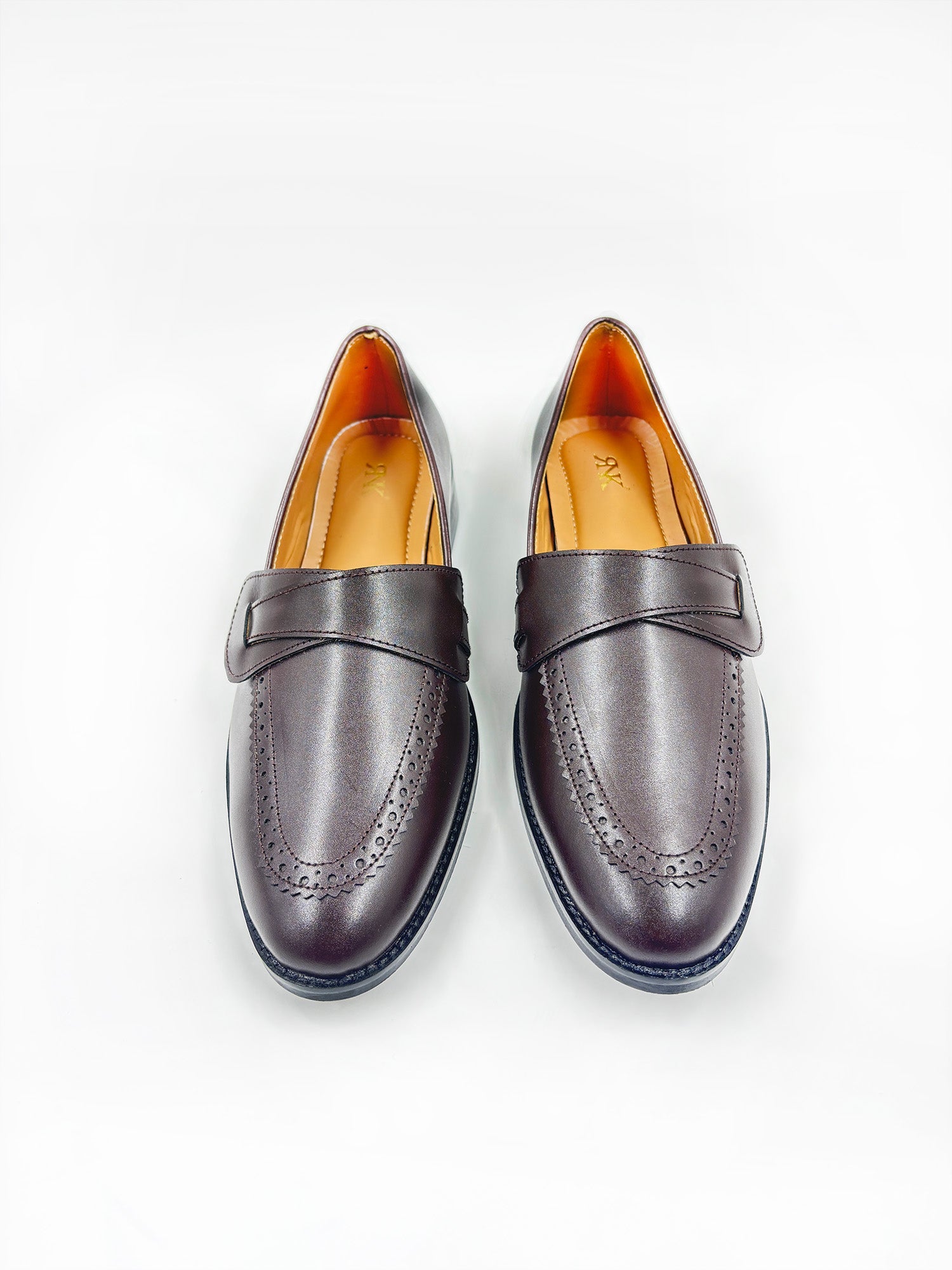 Pair of brown penny loafers on mid heel