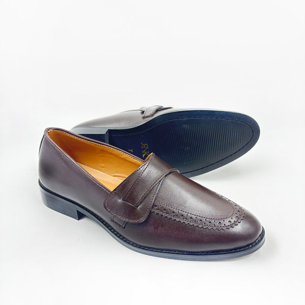 Pair of brown penny loafers on mid heel