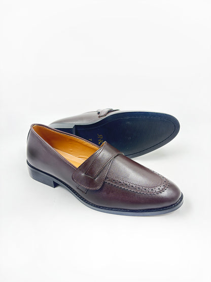 Pair of brown penny loafers on mid heel