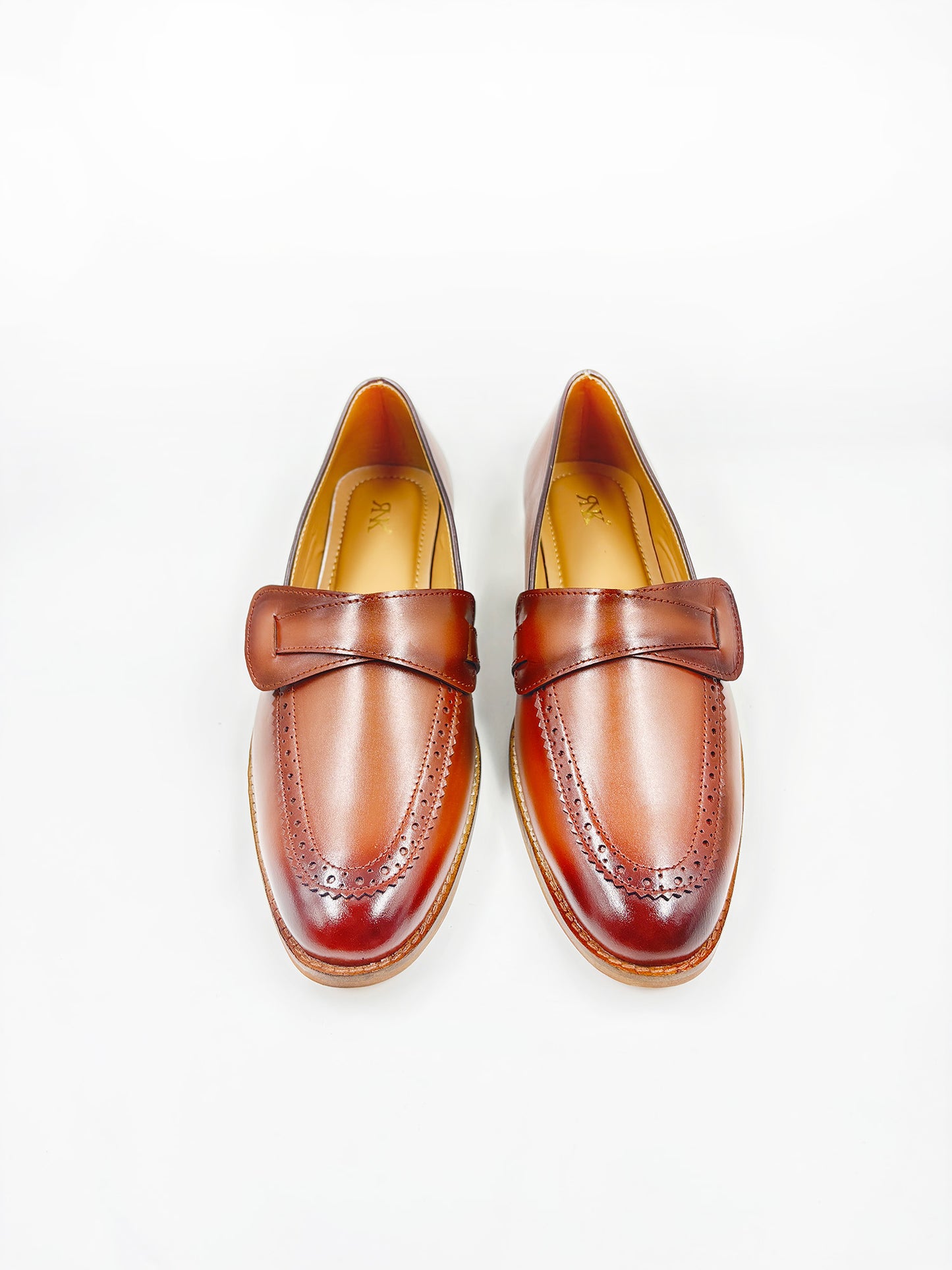 Pair of brown leather penny loafers on mid heel