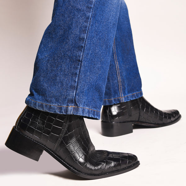 Men’s black crocodile-textured leather Chelsea boots with a sleek, pointed toe design