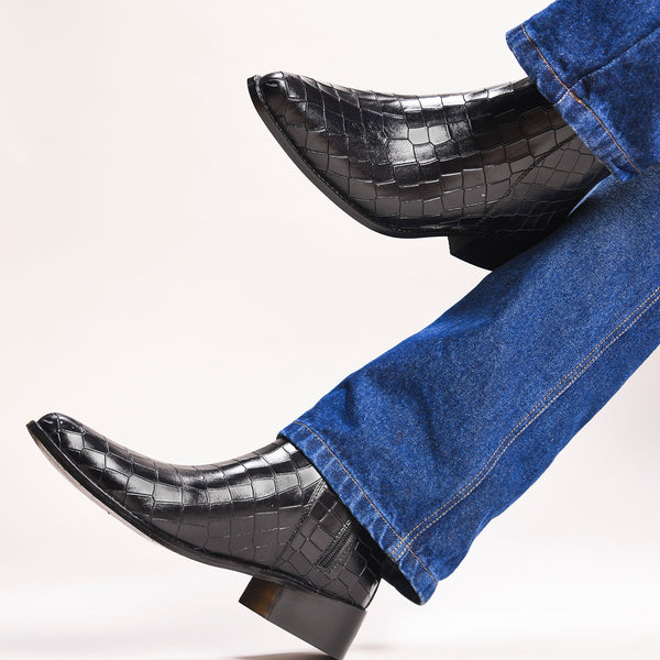 Men’s black crocodile-textured leather Chelsea boots with a sleek, pointed toe design