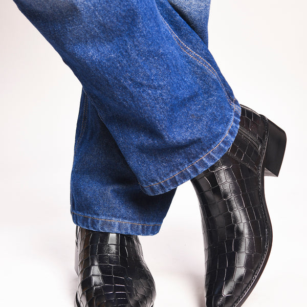 Men’s black crocodile-textured leather Chelsea boots with a sleek, pointed toe design