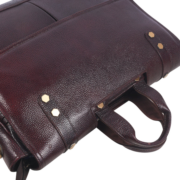 Close-up of a Brown leather messenger bag with gold accents 