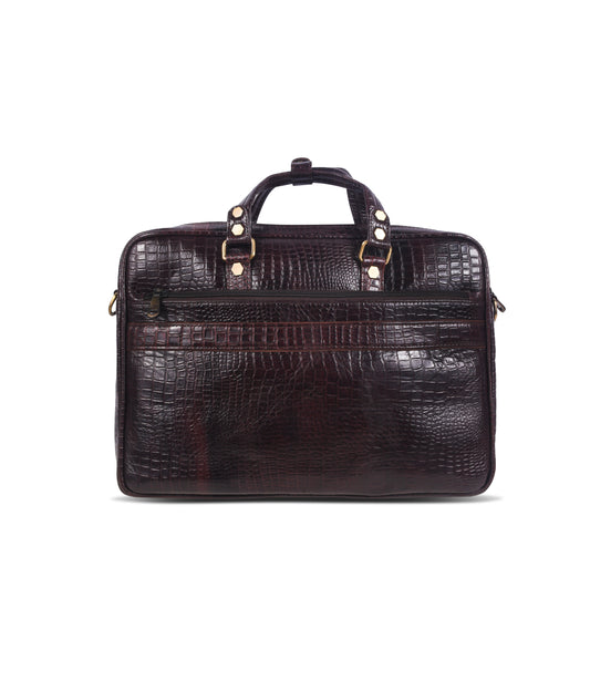 Brown crocodile skin messenger bag with gold accents 