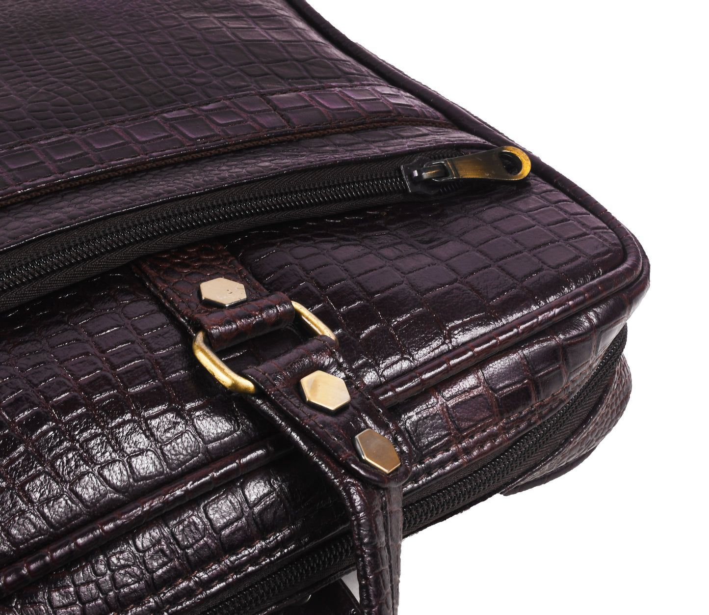 Close-up of a dark brown leather bag with gold accents