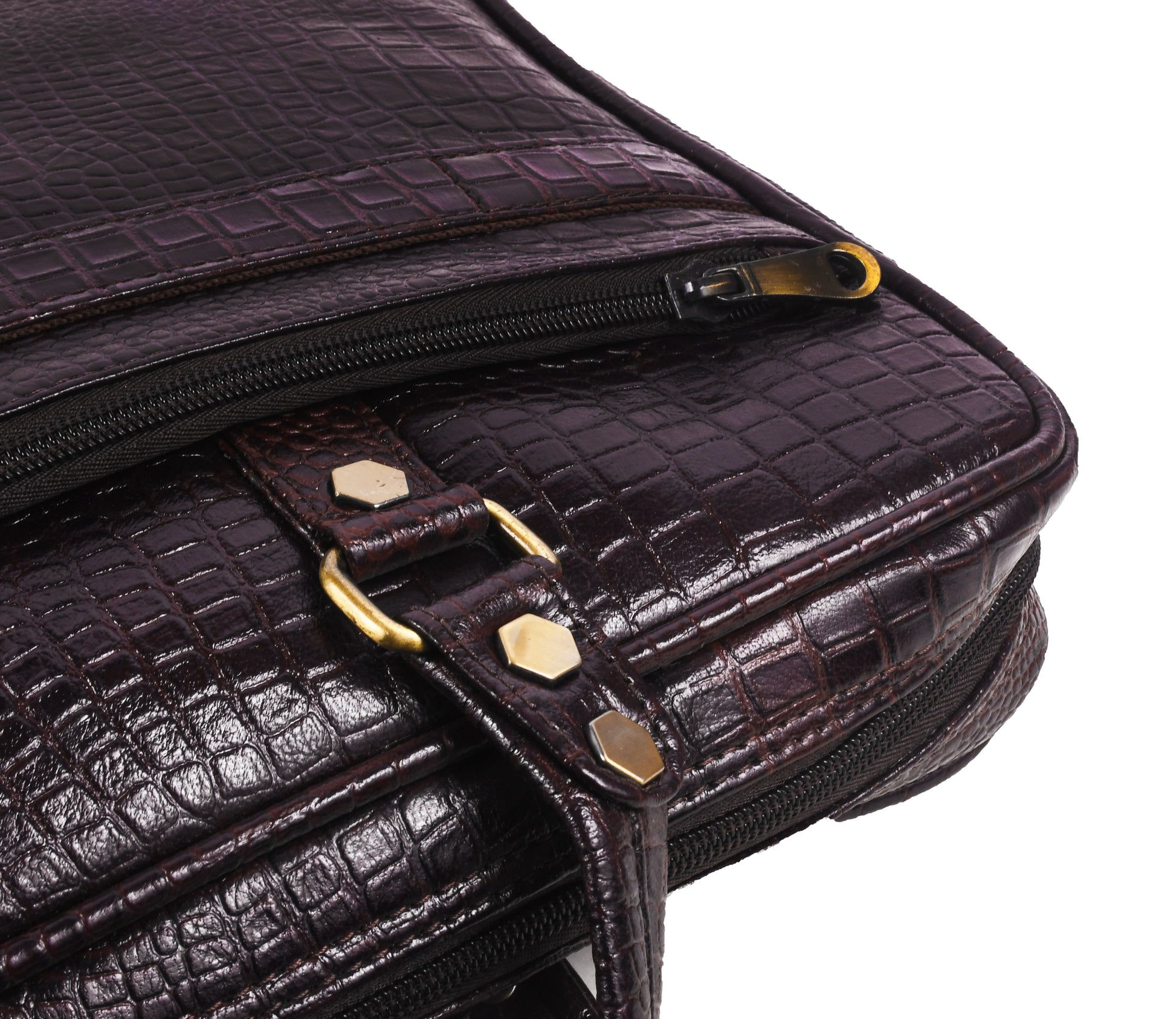 Close-up of a dark brown leather bag with gold accents