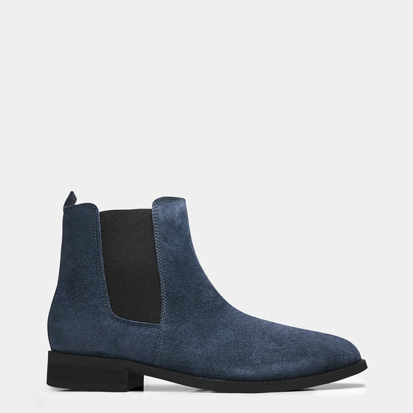 A men's luxury suede leather Chelsea boot with a cuban heel and elastic side panels, in a blue color.