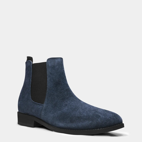 A men's luxury suede leather Chelsea boot with a cuban heel and elastic side panels, in a blue color.