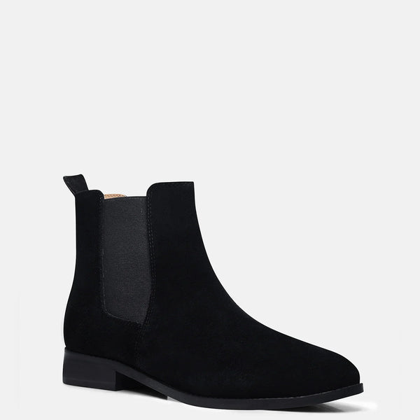 A men's luxury suede leather Chelsea boot with a mid heel and elastic side panels, in a black color.