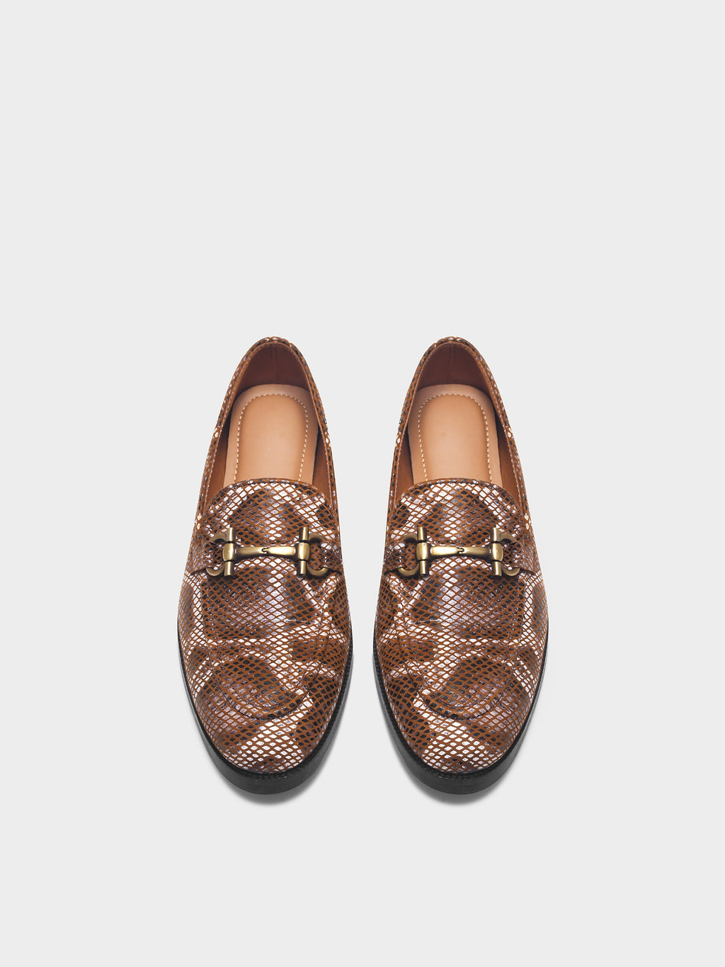 Preview of Pair of brown patterned loafers with gold buckles on a white background