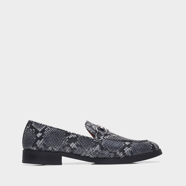 Black and white snake-patterned penny loafer shoe on mid heel with a horsebit buckle