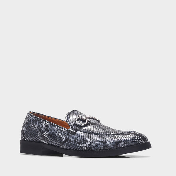 Black and white snake-patterned penny loafer shoe on mid heel with a horsebit buckle
