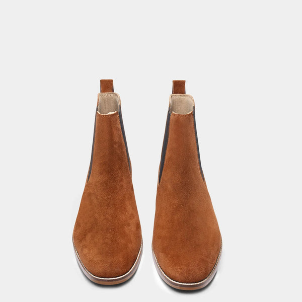 A men's luxury suede leather Chelsea boot with a mid heel and elastic side panels, in a tan color.