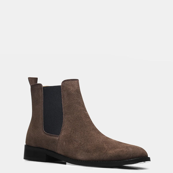 A men's luxury suede leather Chelsea boot with a mid heel and elastic side panels, in a brown color.