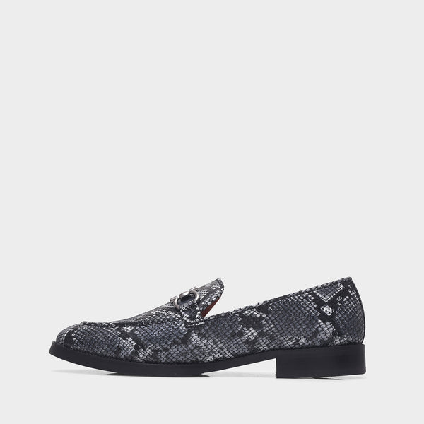 Black and white snake-patterned penny loafer shoe on mid heel with a horsebit buckle