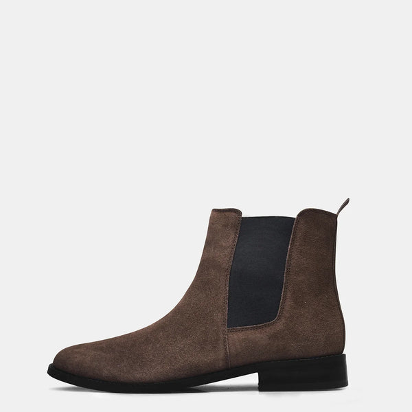 A men's luxury suede leather Chelsea boot with a mid heel and elastic side panels, in a brown color.