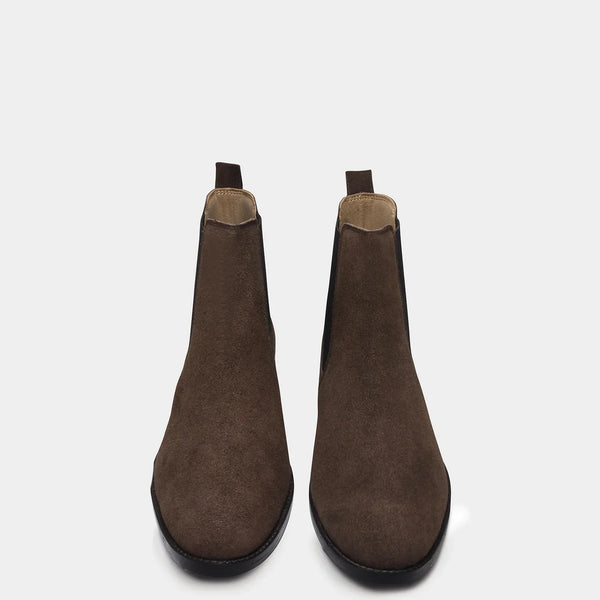 A men's luxury suede leather Chelsea boot with a mid heel and elastic side panels, in a brown color.