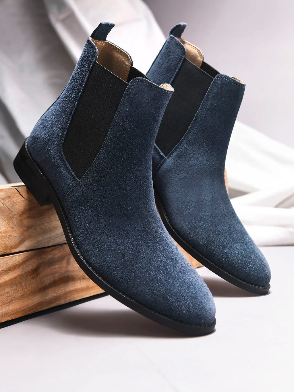 Preview of A men's luxury suede leather Chelsea boot with a cuban heel and elastic side panels, in a blue color.