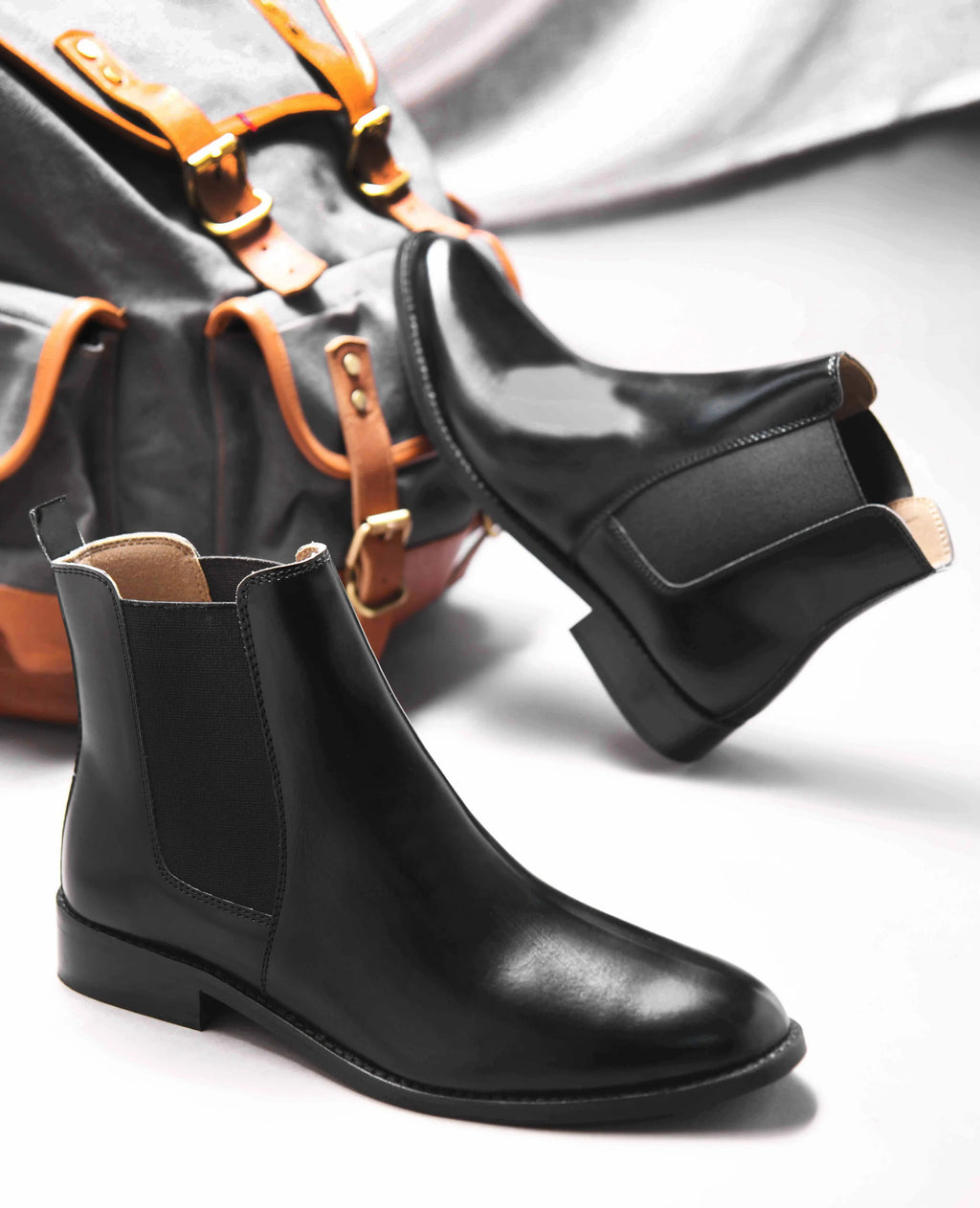 Preview of Black leather boots with side elastic and mid heel