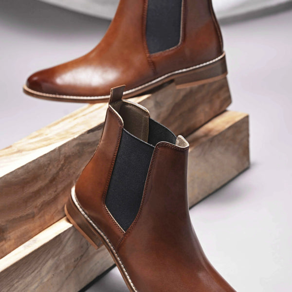 Brown leather Chelsea boot with side elastic and mid heel 