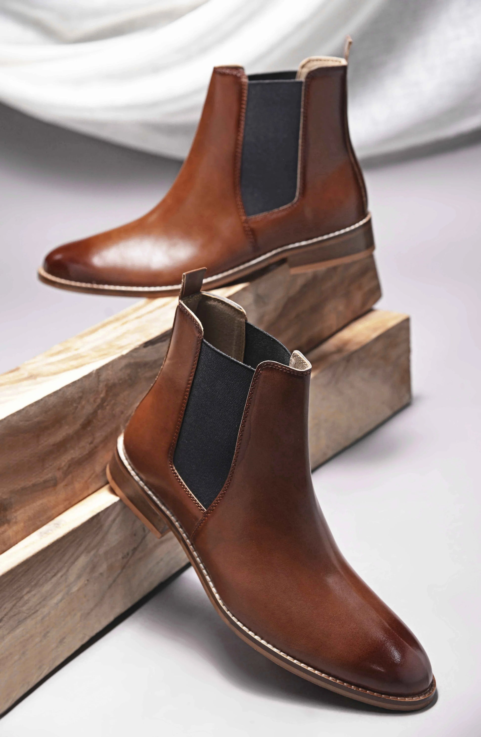 Brown leather Chelsea boot with side elastic and mid heel 