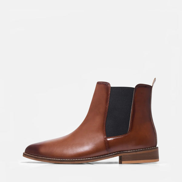 Brown leather Chelsea boot with a black elastic side and mid heel