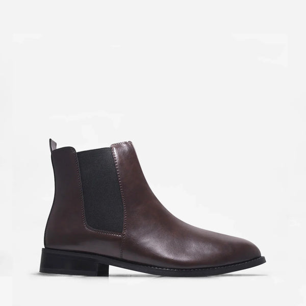 Brown leather Chelsea boot with side elastic and mid heel on a white background