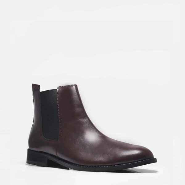 Brown leather Chelsea boot with side elastic and mid heel on a white background