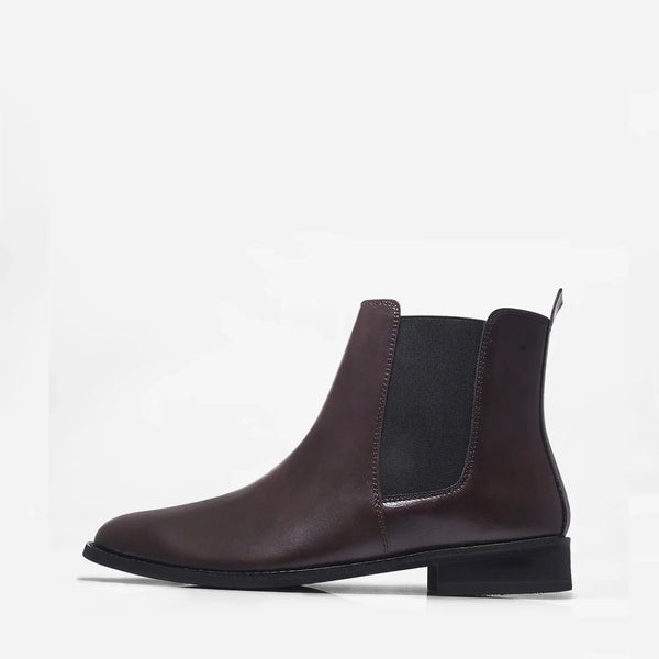 Brown leather Chelsea boot with side elastic and mid heel on a white background