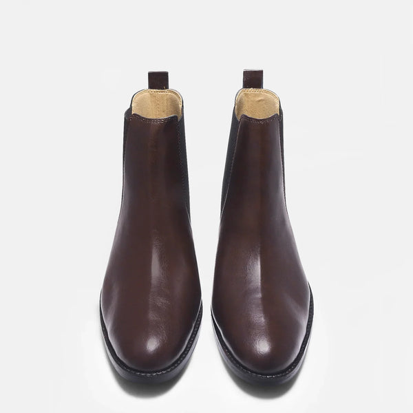 Brown leather Chelsea boot with side elastic and mid heel on a white background