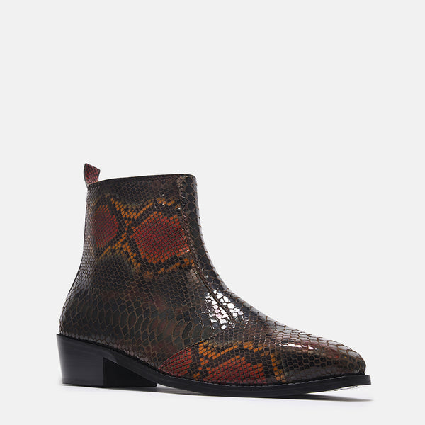 A men's leather boot with a snake-textured boot, featuring a Cuban heel and a side zipper.