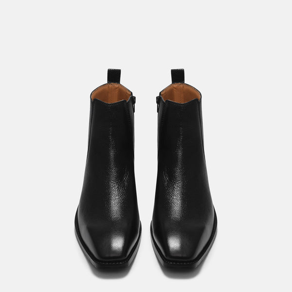 A men's leather side zip boot with a cuban heel, primarily black in color.