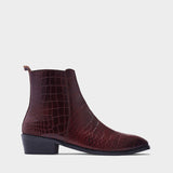 Burgundy crocodile textured leather boots with Cuban heel
