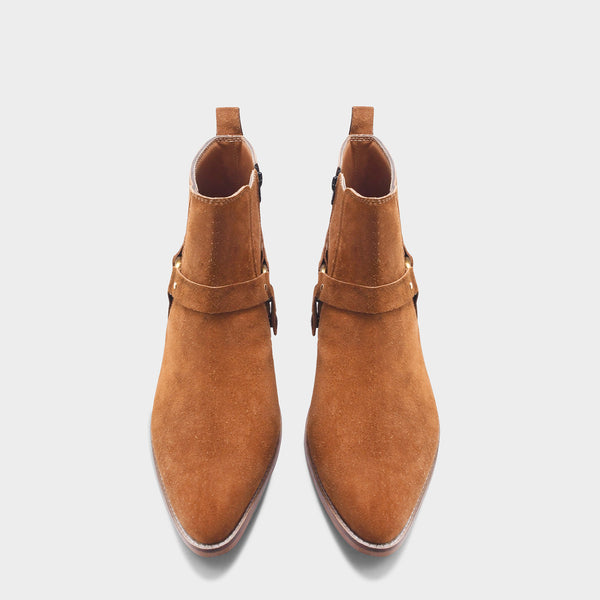 Pair of tan suede boots on Cuban heel with tan coloured buckle on side with golden accents