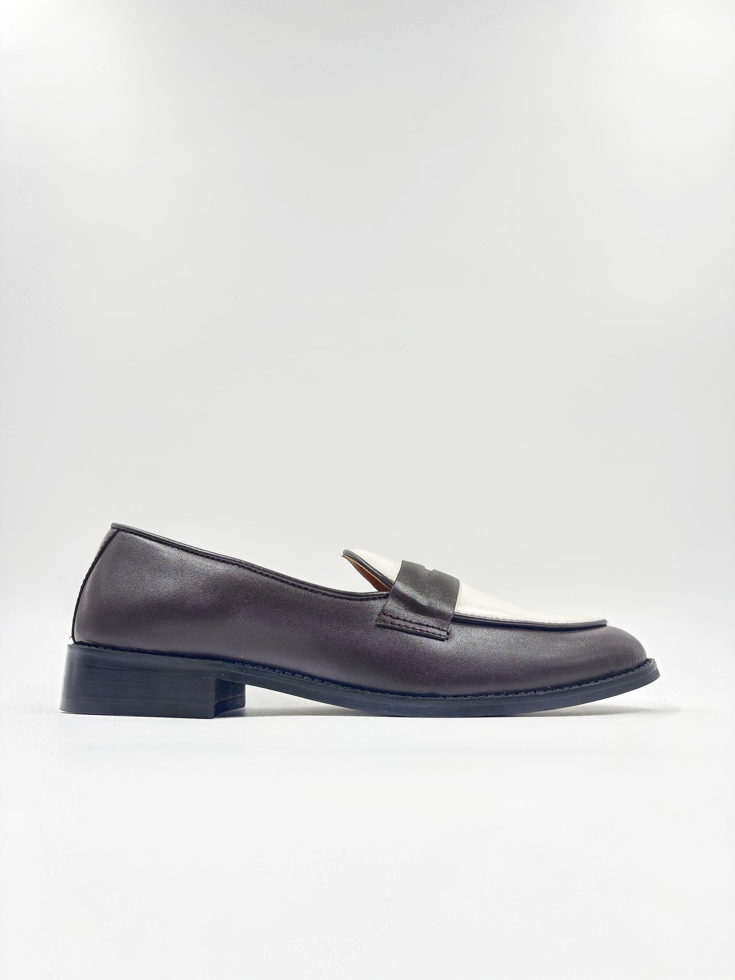 Brown and white leather loafers on a mid heel 