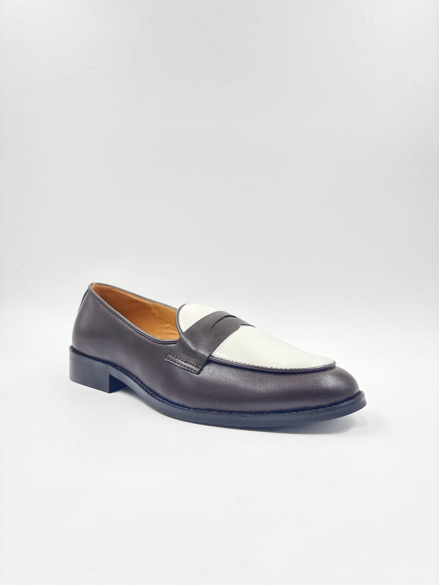 Brown and white leather loafers on a mid heel 
