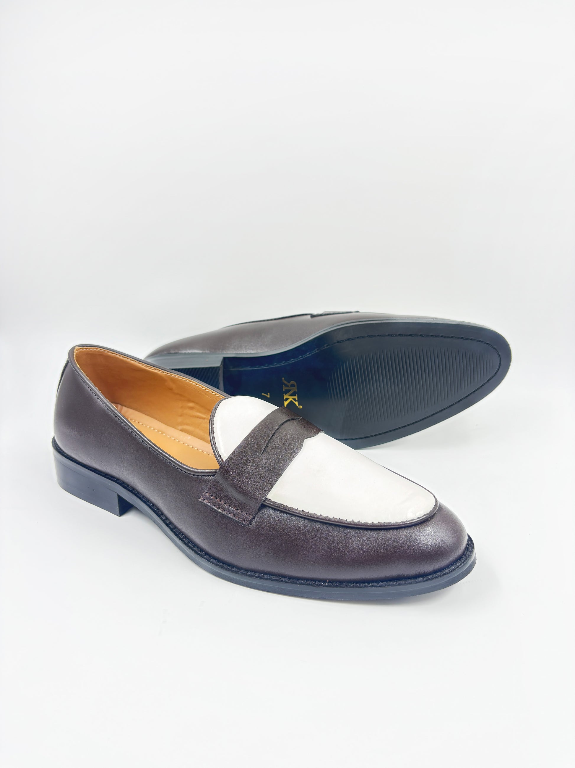 Brown and white leather loafers on a mid heel 