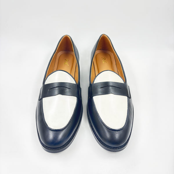 Black and white leather loafers on a mid heel 