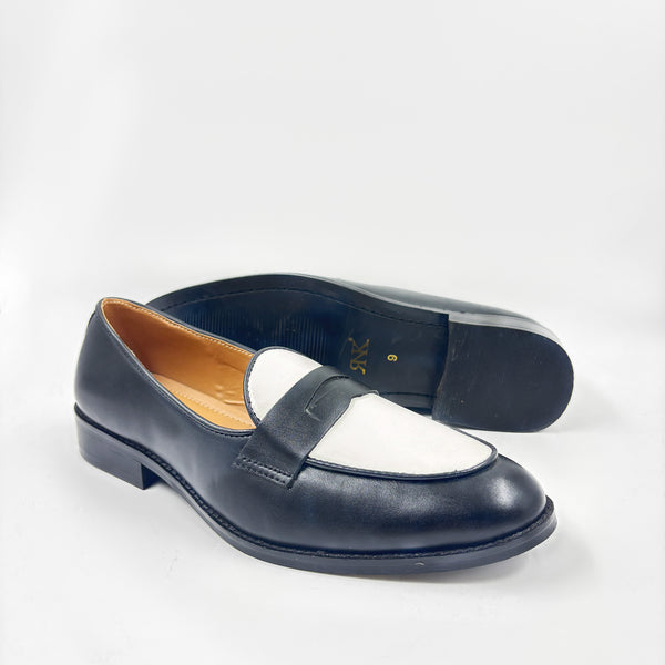 Black and white leather loafers on a mid heel 