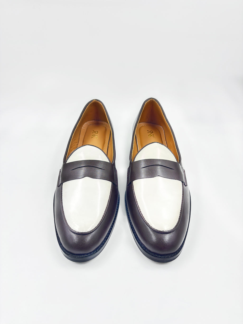 Preview of Brown and white leather loafers on a mid heel 