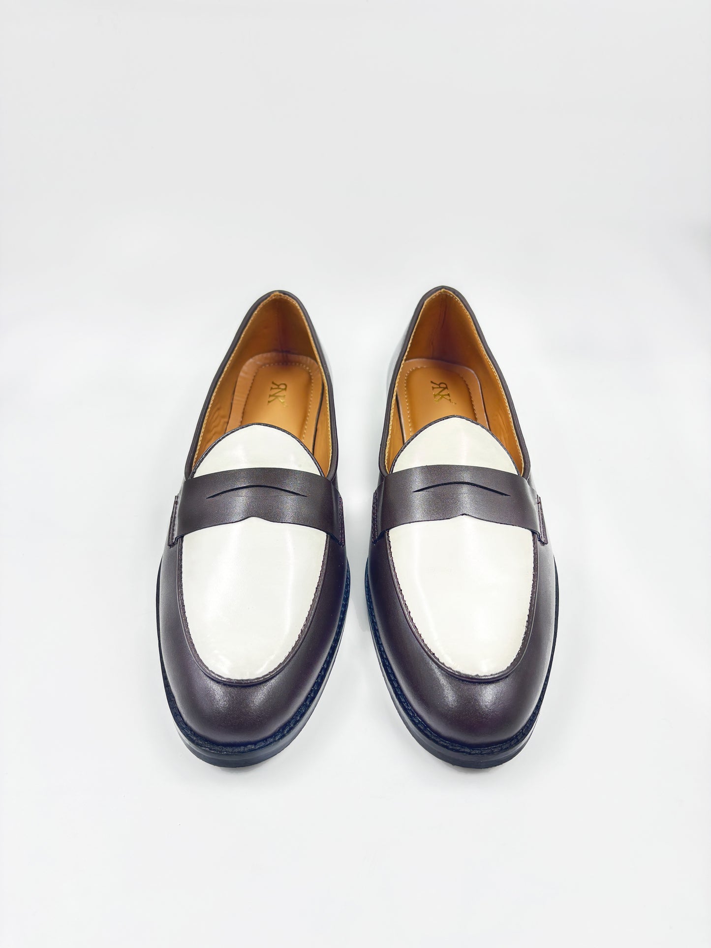 Brown and white leather loafers on a mid heel 