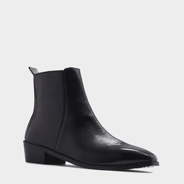 Black patent leather boots with side zipper on a Cuban heel