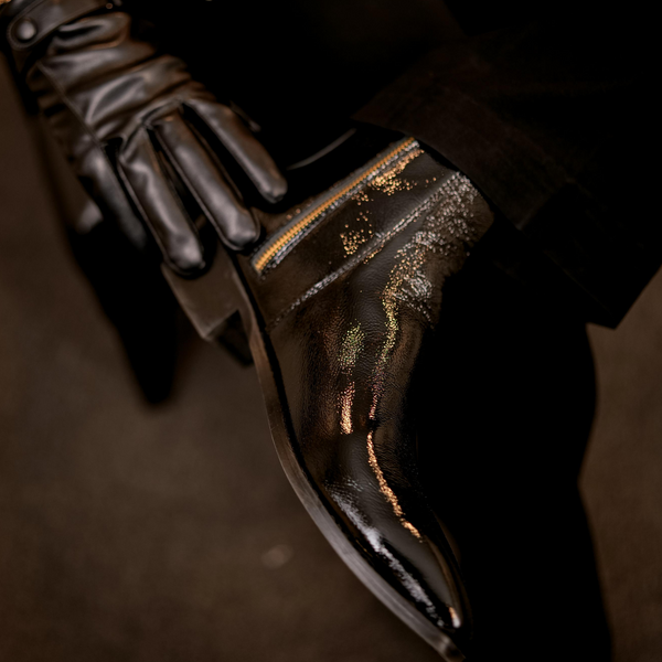 Close-up of a black patent boot named Knight walker designed b RNK Luxe