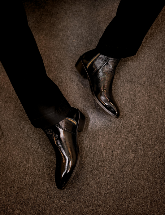 Close-up of a black patent boot named Knight walker designed b RNK Luxe
