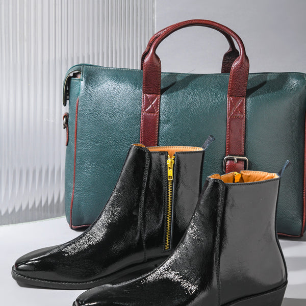Black patent leather boots on Cuban heel with green leather bag with brown streps
