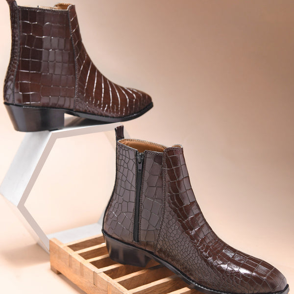 A brown leather side zip boot with a crocodile pattern and a Cuban heel.