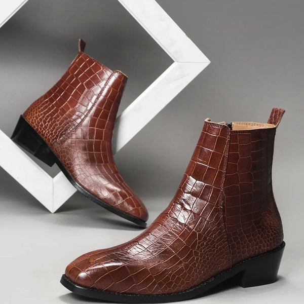 Pair of tan colour crocodile textured leather boots with side zip on a Cuban heel