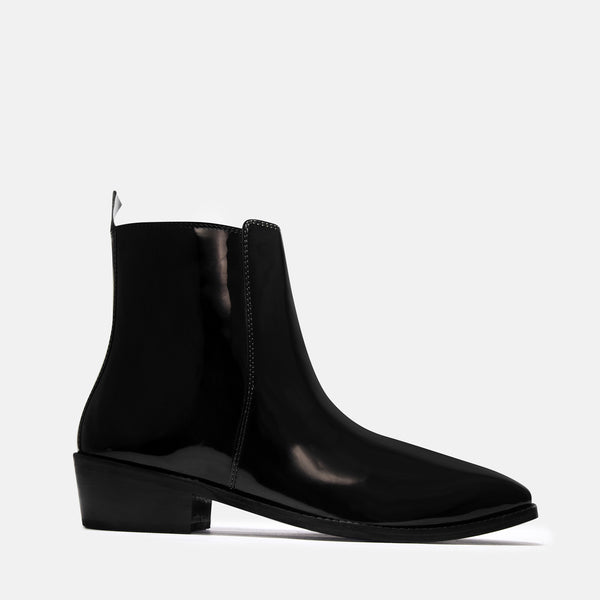 A man's patent leather boot in black or a Cuban heel